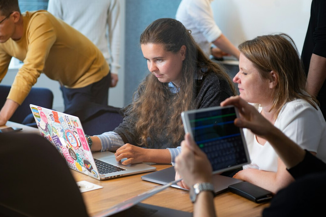 group of people learning to code together